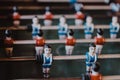 Selective shot of an aged foosball football player figures