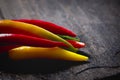 Selective shot of different types of Chili peppers on a stone plate Royalty Free Stock Photo