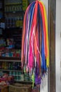 Selective shot of numerous colorful shoelaces hanging on a hanger