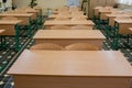 Selective soft and blur focus.old wooden row lecture chairs in classroom in poor school.study room without student.concept for Royalty Free Stock Photo