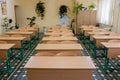 Selective soft and blur focus.old wooden row lecture chairs in classroom in poor school.study room without student.concept for Royalty Free Stock Photo