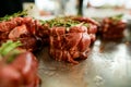 selective view of delicious meat steak with pepper and salt and sprigs of rosemary
