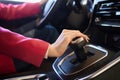 Selector automatic transmission with leather in the interior of a modern expensive car. The background is blurred. Black and brown Royalty Free Stock Photo