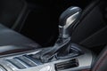 Selector automatic transmission with leather in the interior of a modern expensive car. The background is blurred Royalty Free Stock Photo