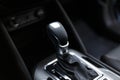 Selector automatic transmission with leather in the interior of a modern expensive car. The background is blurred Royalty Free Stock Photo