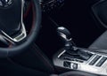 Selector automatic transmission with leather in the interior of a modern expensive car. The background is blurred Royalty Free Stock Photo