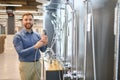 Selects a shower faucet. Man chooses a products in a sanitary ware store