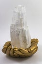 Selenite Tower in Golden hands.