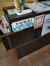 Self adhesive signboard of `Cash term` english language with mandarin and malay interpretation paste by the side counter table