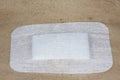 Self-adhesive white gauze dressing for laparoscopic surgical wound protection in the abdomen Royalty Free Stock Photo