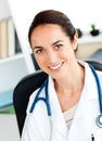 Self-assured female doctor smiling at the camera Royalty Free Stock Photo