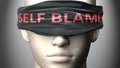 Self blame can make things harder to see or makes us blind to the reality - pictured as word Self blame on a blindfold to