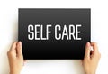 Self Care text on card, health concept background Royalty Free Stock Photo