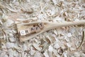 Self carved wooden spoon cooking spoon pan scraper with the word - CRAFT - on a workbench with wood chips, Germany