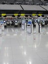 Self check in machine hall and help desk kiosk at airport for check in, printing boarding pass or buying ticket,
