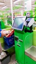 Self-checkout made by a male customer in a finnish supermarket