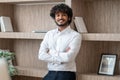 Young indian businessman sstanding with arms crossed