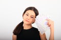 Self confident pretty girl with money - banknotes in fan Royalty Free Stock Photo