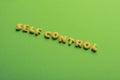 Self controt concept, words made of cookies isolated on green