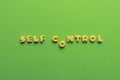 Self controt concept, words made of cookies isolated on green