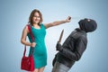 Self defense concept. Young woman is defending herself with pepper spray. Royalty Free Stock Photo