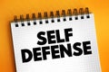 Self Defense is a countermeasure that involves defending the health and well-being of oneself from harm, text concept on notepad Royalty Free Stock Photo