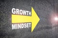 Growth mindset with yellow arrow marking on road surface Royalty Free Stock Photo
