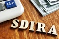 Self Directed IRA - SDIRA wooden letters Royalty Free Stock Photo
