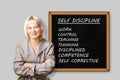 Woman near boarg with text Self Discipline, Control, Work, Thinking, Disciplined