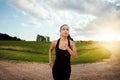 Self-discipline makes all things possible. a fit young woman out for a run on a beautiful day.