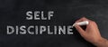 Self discipline is standing on a chalkboard, improvement by education, willpower to reach a goal Royalty Free Stock Photo