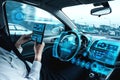 Self-drive autonomous car with man at driver seat Royalty Free Stock Photo