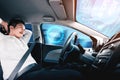 Self-drive autonomous car with man at driver seat. Royalty Free Stock Photo