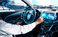 Self-drive autonomous car with man at driver seat. Royalty Free Stock Photo