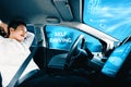 Self-drive autonomous car with man at driver seat. uds Royalty Free Stock Photo