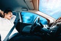 Self-drive autonomous car with man at driver seat. uds Royalty Free Stock Photo