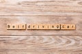 Self-driving car word written on wood block. Self driving car text on wooden table for your desing, concept Royalty Free Stock Photo