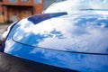 Self driving Tesla Model Y Exterior. Blue metallic, black titanium rims, panoramic sunroof, led headlights