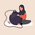 Self flagellation. Sad arabian woman hugging wrecking ball and feeling guilty. Concept of psychological self-harm