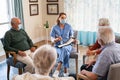 Self help therapy group meeting in nursing home during covid Royalty Free Stock Photo