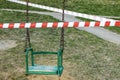 Self-isolation, a ban on walking. Children`s swings are closed, you can`t ride Royalty Free Stock Photo