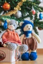 Self knitted kitty cat and teddy bear under Christmas tree Royalty Free Stock Photo