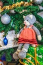 Self knitted kitty sitting on gift boxes under Christmas tree Royalty Free Stock Photo