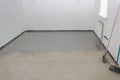 Self-leveling epoxy. Leveling with a mixture of cement floors Royalty Free Stock Photo