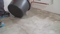 self leveling compound spreading. Self-leveling floor. Self-filling floor. Liquid floor. The solution spreads over the