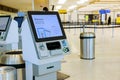 Self service machine desk kiosk at airport for check in printing boarding pass and buying ticket