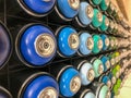 Self painting, graffiti - multi-colored spray cans with paint on the rack for self car repair Royalty Free Stock Photo