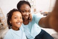 Happy afro mother and daughter doing selfie Royalty Free Stock Photo