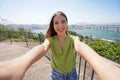 Self portrait of Brazilian woman with the Terceira Ponte bridge that unites the city of Vila Velha to Vitoria in Espirito Santo Royalty Free Stock Photo