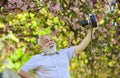 Self portrait. Memories in snap. Everyone photogenic. Senior man taking selfie photo vintage camera. Retro equipment for Royalty Free Stock Photo